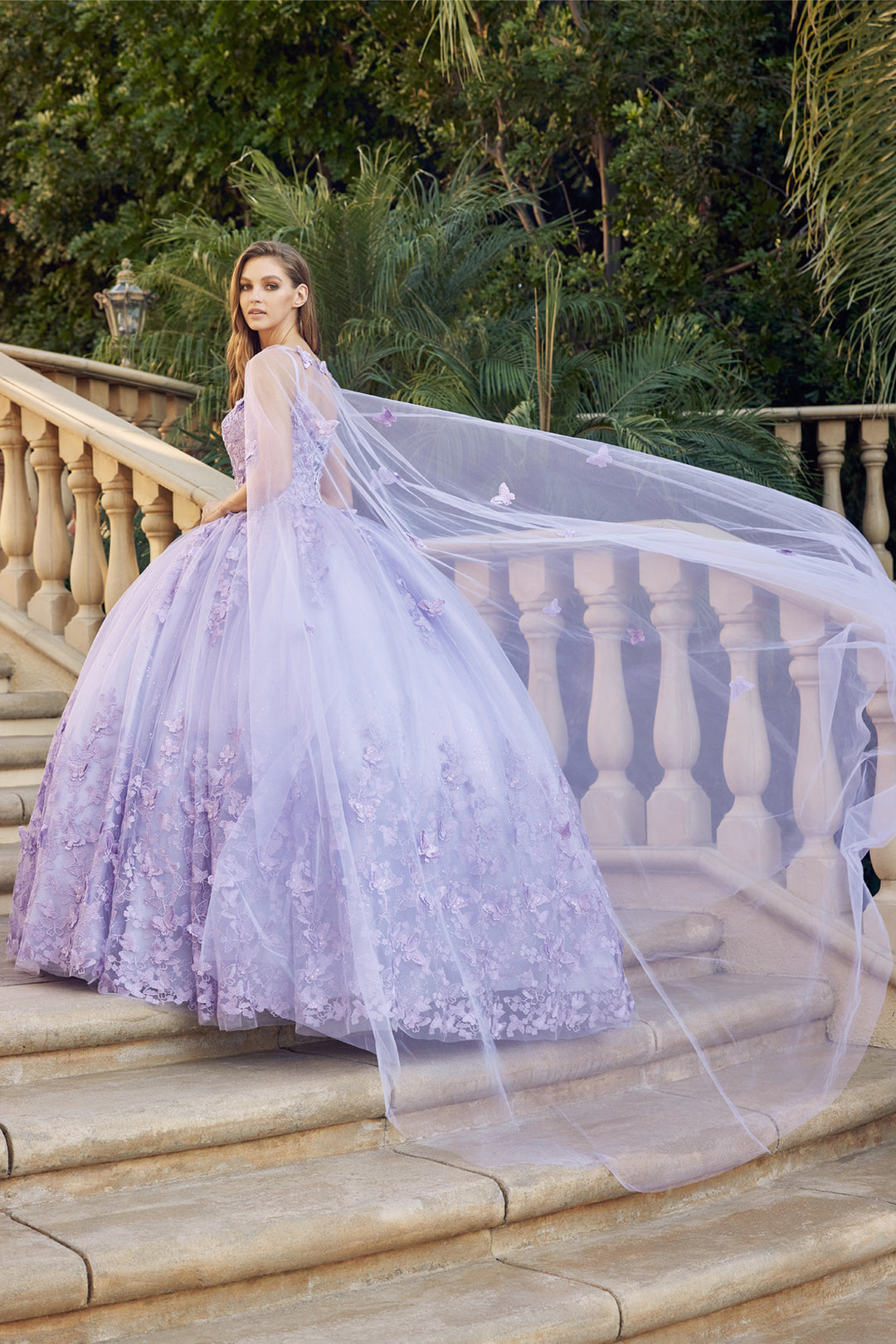 Juliet 1442 butterfly appliqué cape quinceanera dress back three-quarter view with sheer cape, option 2